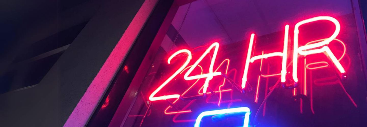 a-pink-and-blue-neon-24-hour-care-sign-symbolising-the-benefits-of-24-hour-private-home-care-in-cheshire