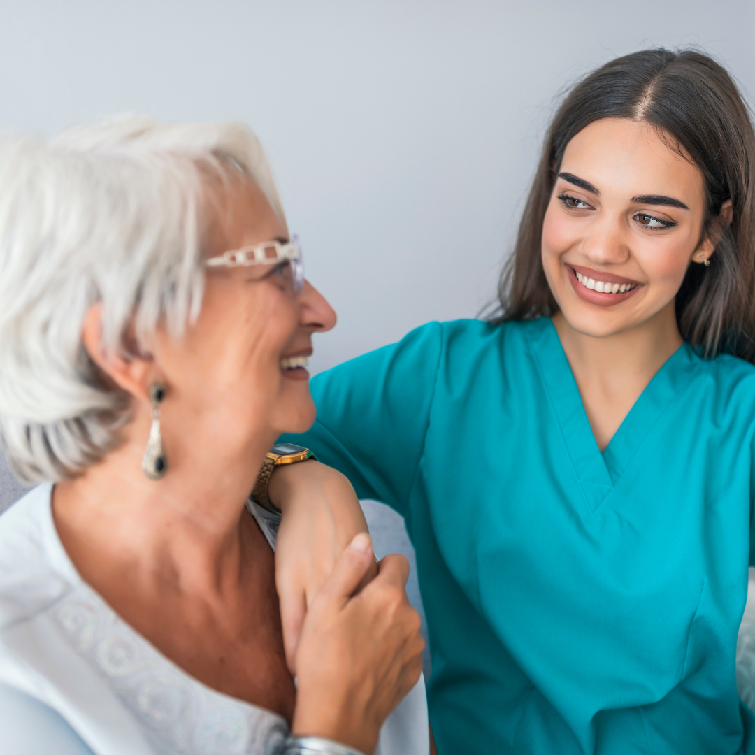 Elderly lady with young carer
