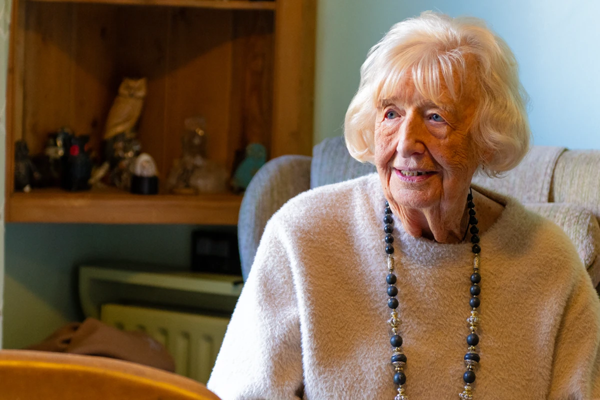 Client receiving round-the-clock care at home with a dedicated Carer nearby.