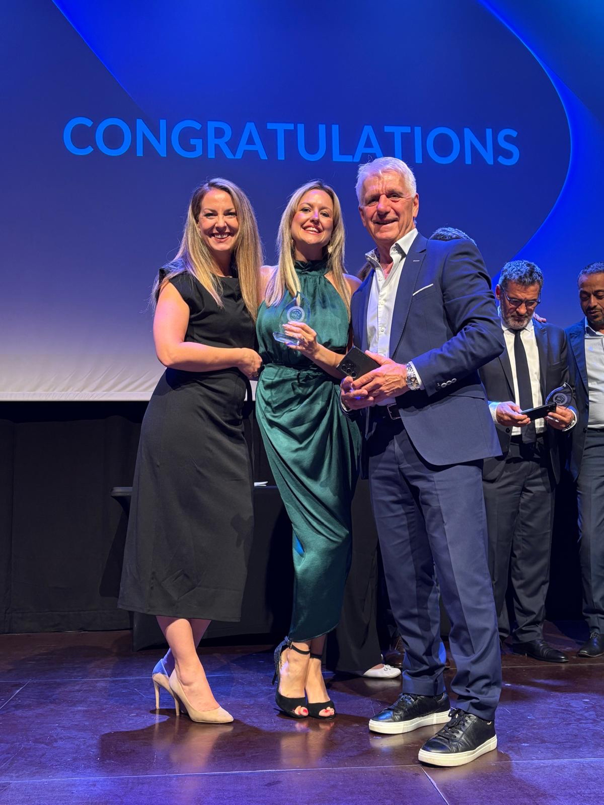 Ken, Lucy and Heather celebrate franchise award
