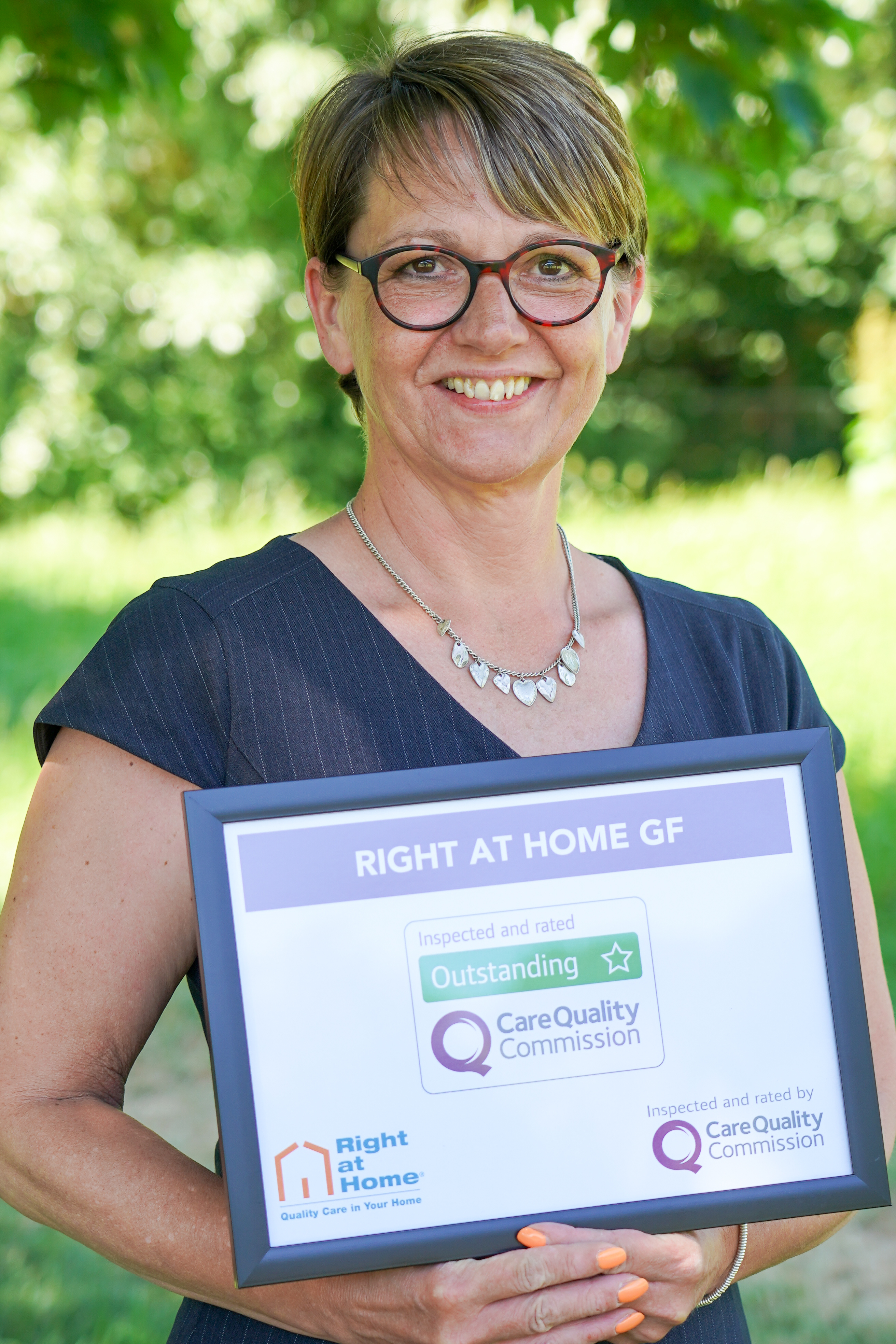 Smiling female holding a certificate