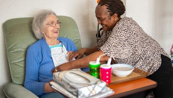 caregiver supporting client to eat