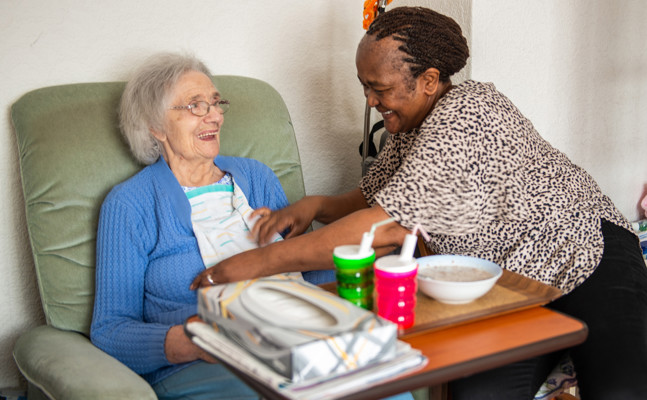 CareGiver helping client with mealtime