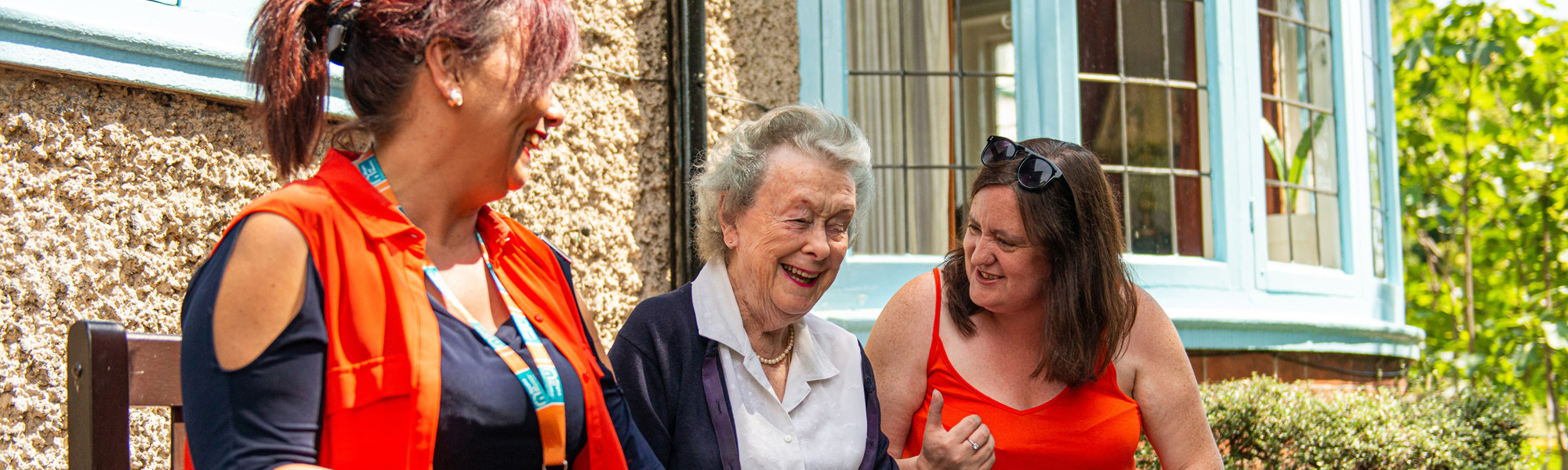 CareGivers and client talking on a bench