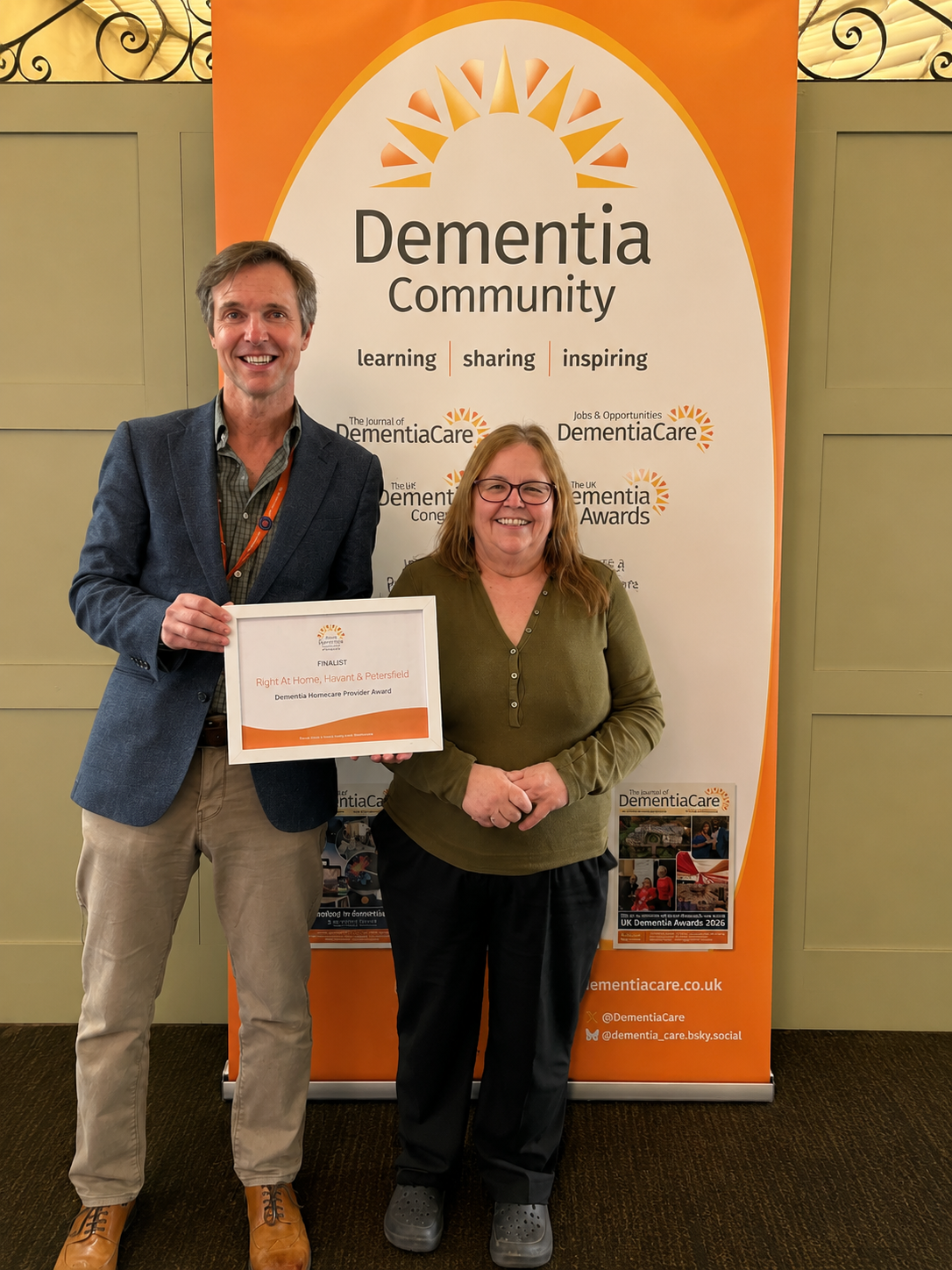 Duncan Cameron, owner and Nickki Haggar, Registered Manager  receiving the award