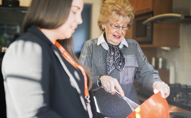 Client and CareGiver Baking in Kitchen