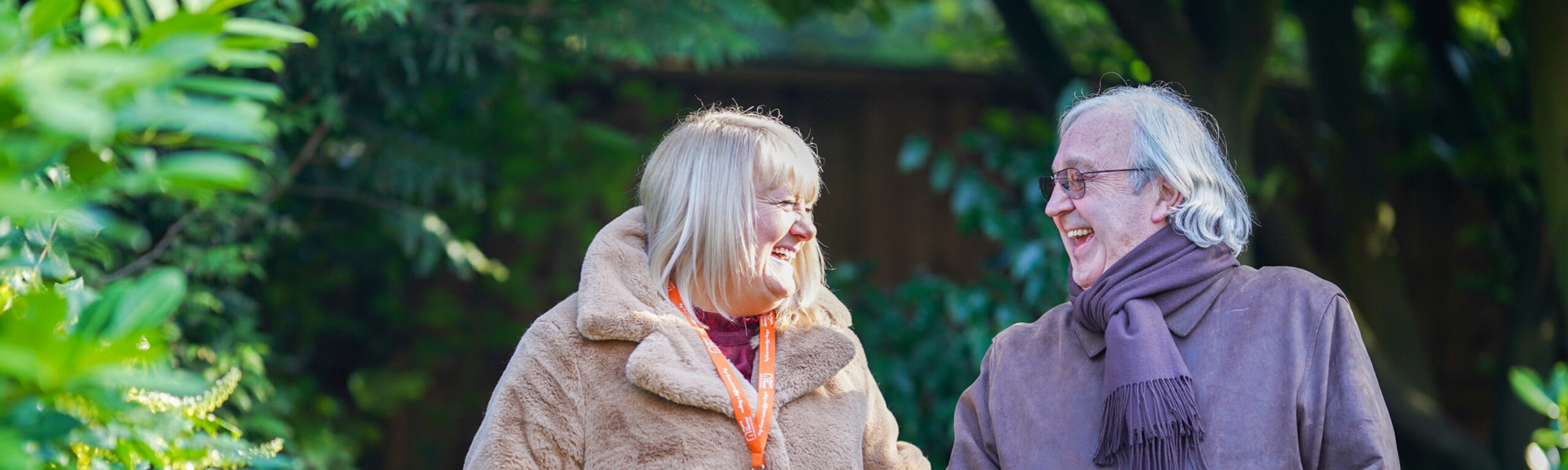 Caregiver and client outside smiling