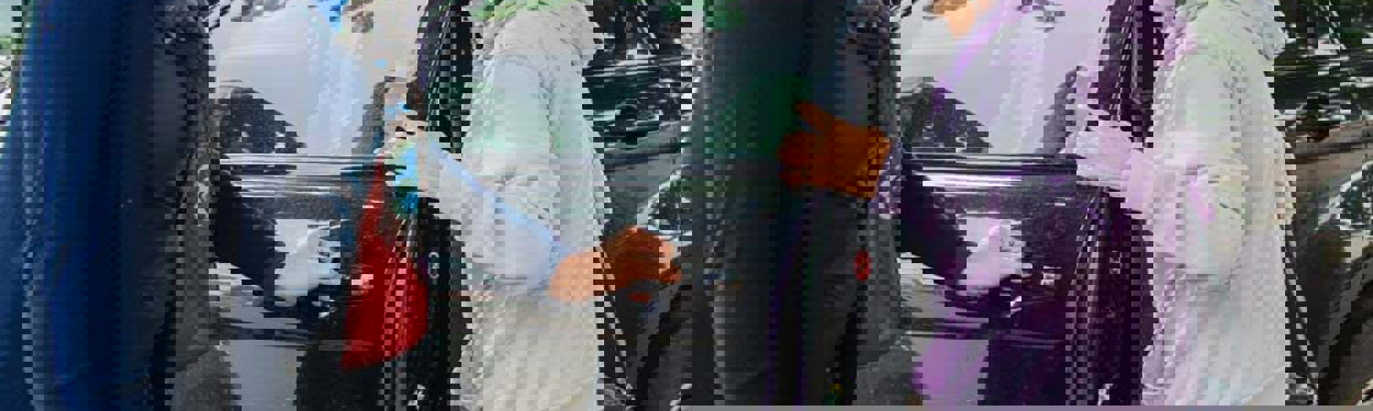 Client being helping into car by CareGiver