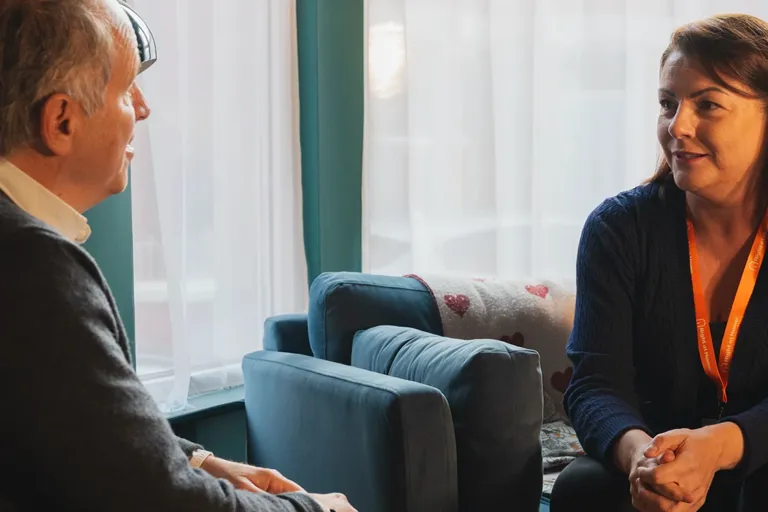 Client recovering at home after a hospital stay with support from their Carer