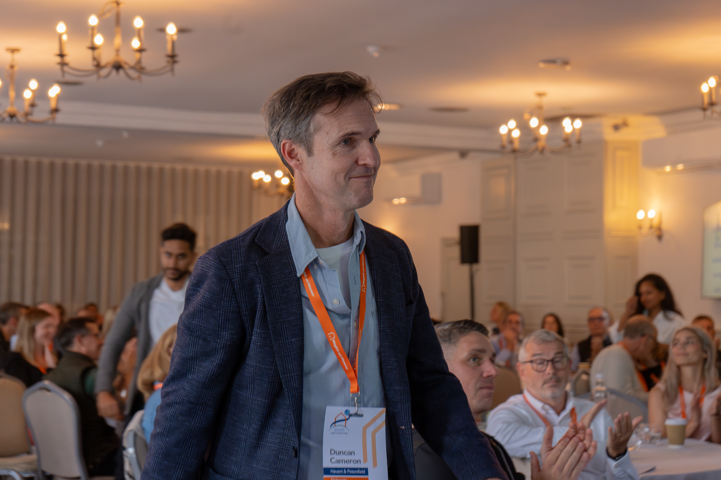 duncan cameron collects award at conference