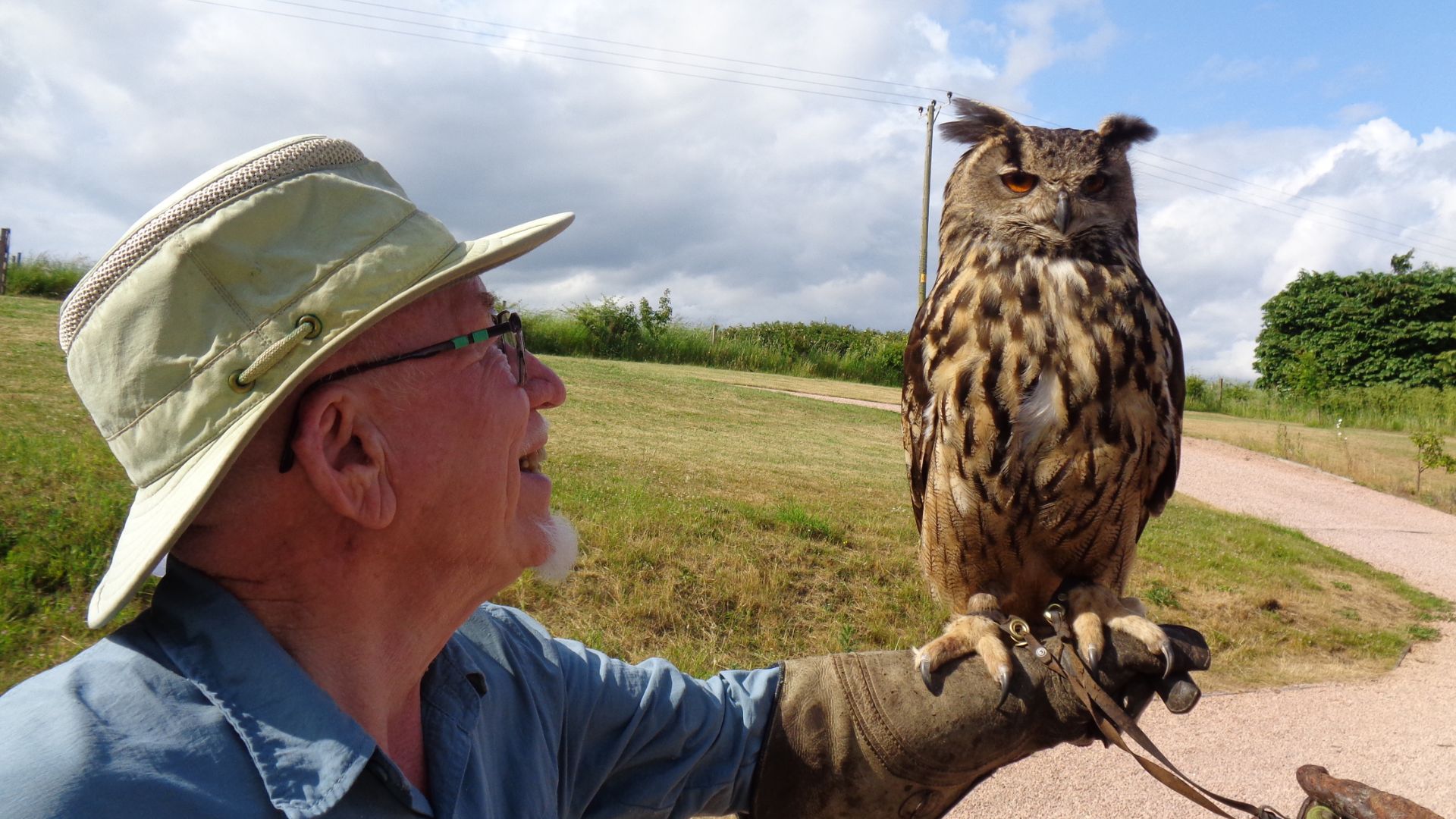 man holding owl
