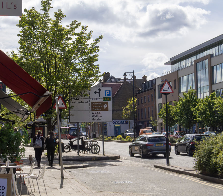 high street with cars and pedestrians in Esher