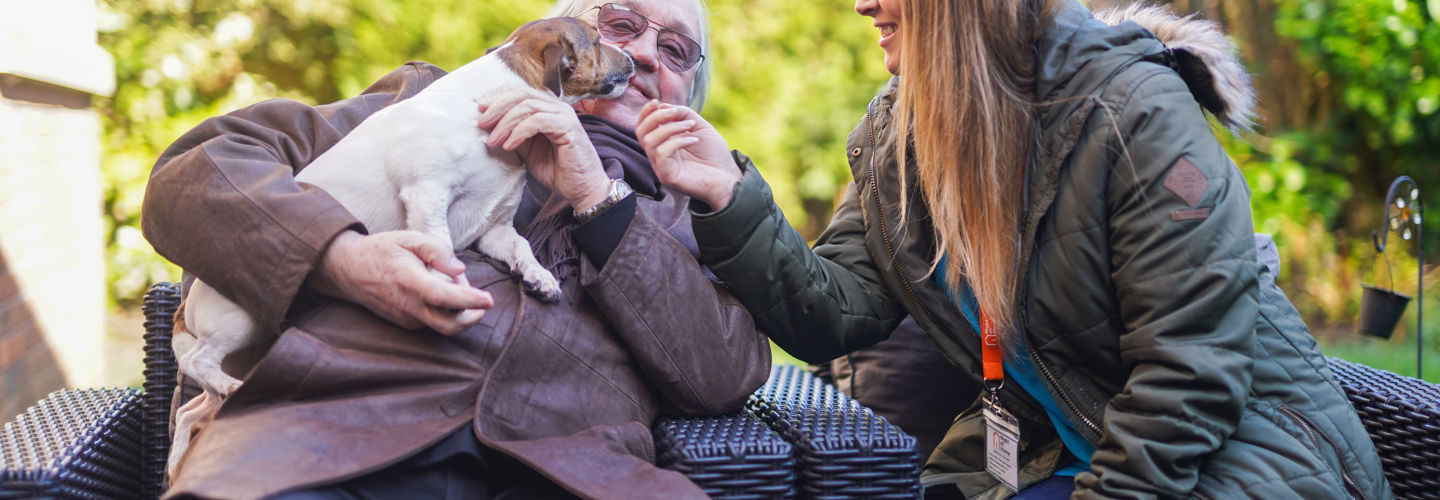 2 people and a dog