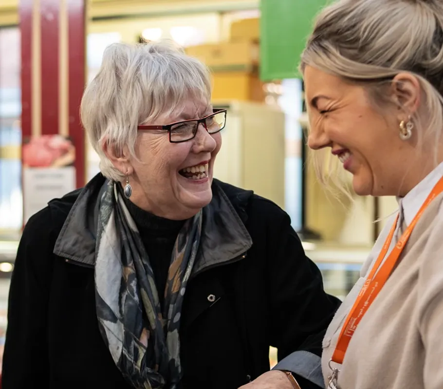 Carer and Client enjoying a trip to the local market
