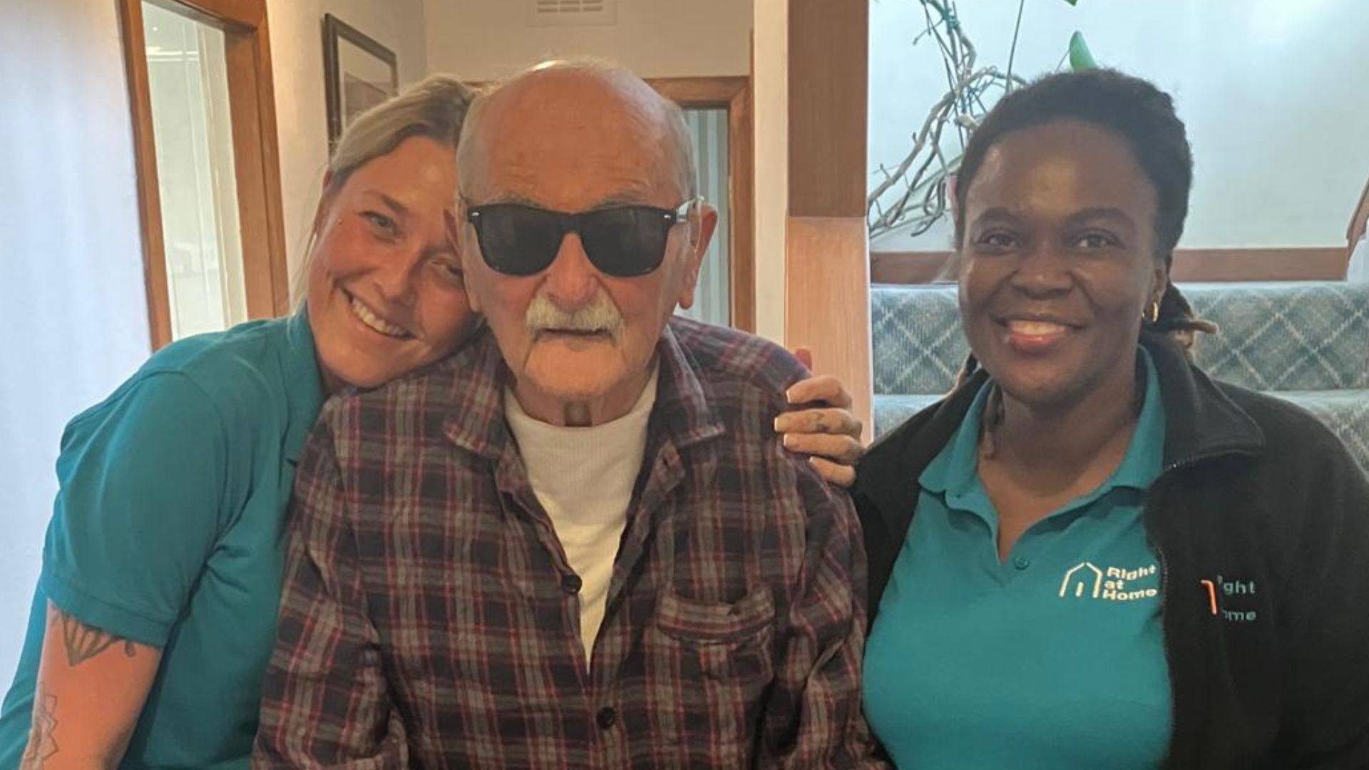 client and carers smiling
