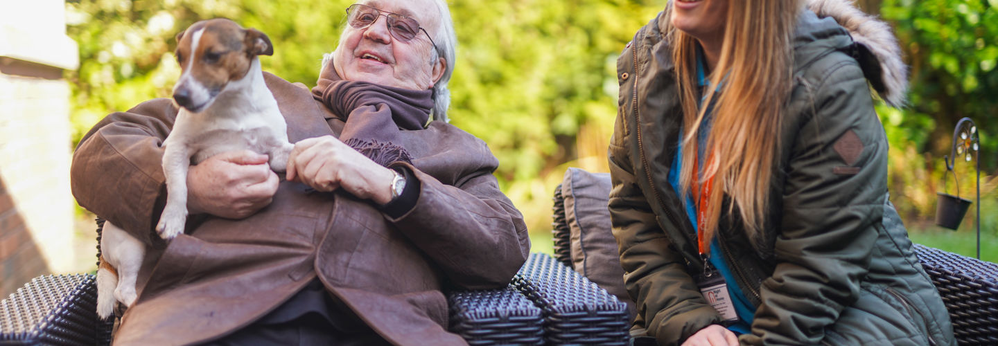 Client and CareGiver with a dog