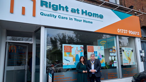 Apurva and Mayor Frank kelly stand outside the Right at Home Reigate office