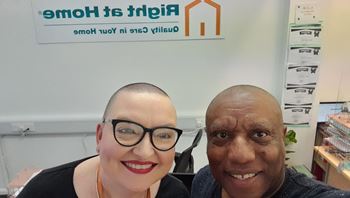 Tina and Grantley stand together showing off their newly shaved heads!!!