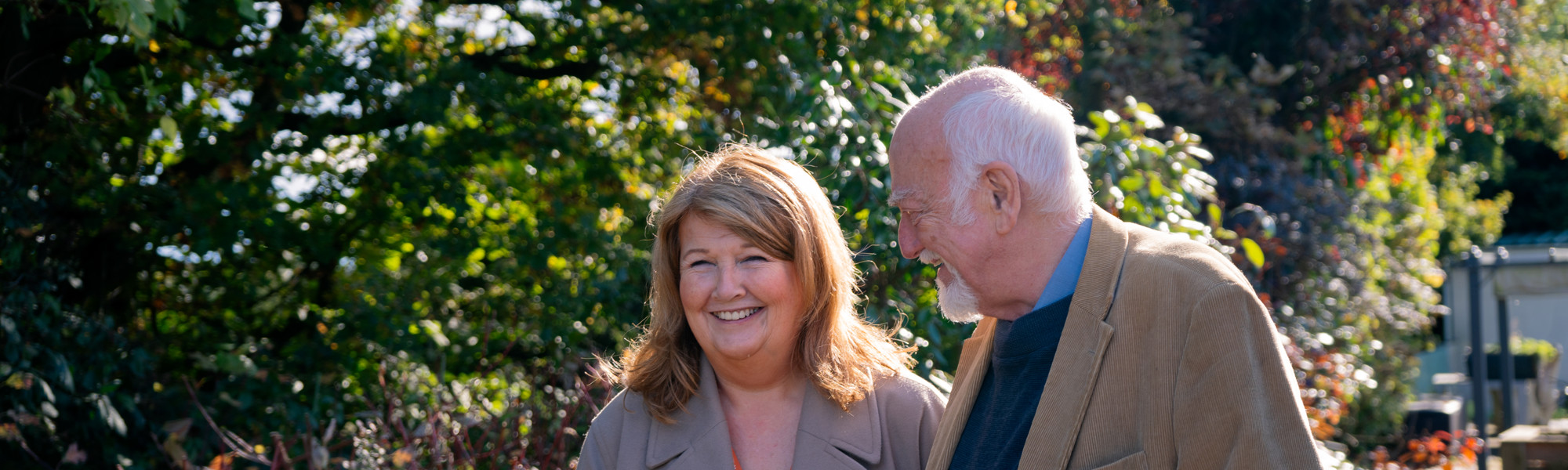Homecare Client Enjoying A Walk With Carer