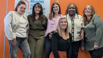 care professionals pose in office