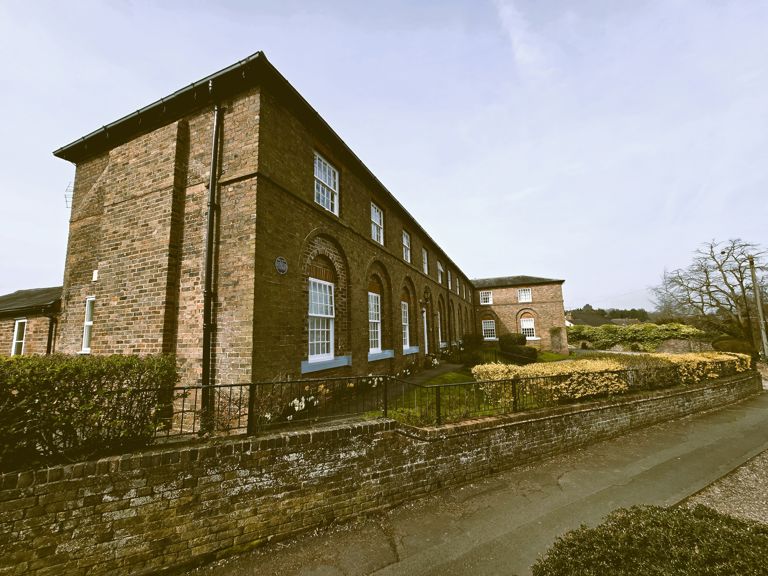 Historic Shifnal workhouse building in Shropshire reflecting early care history