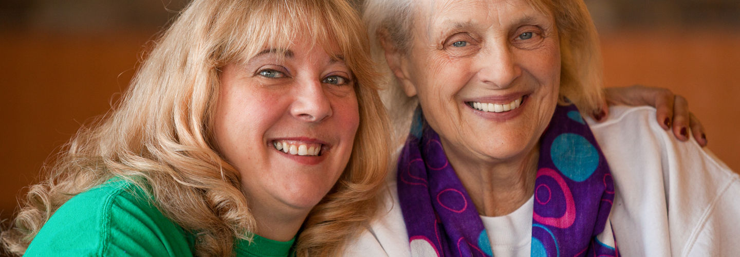 caregiver sharing a smile with a client