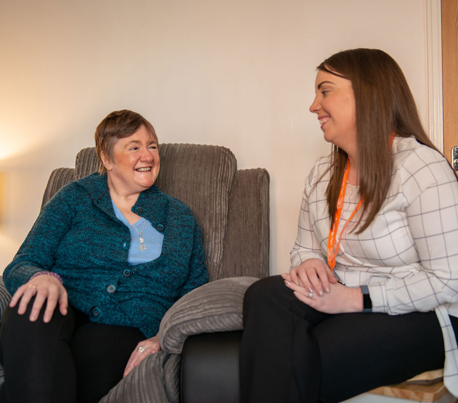 Client and CareGiver sitting down and speaking