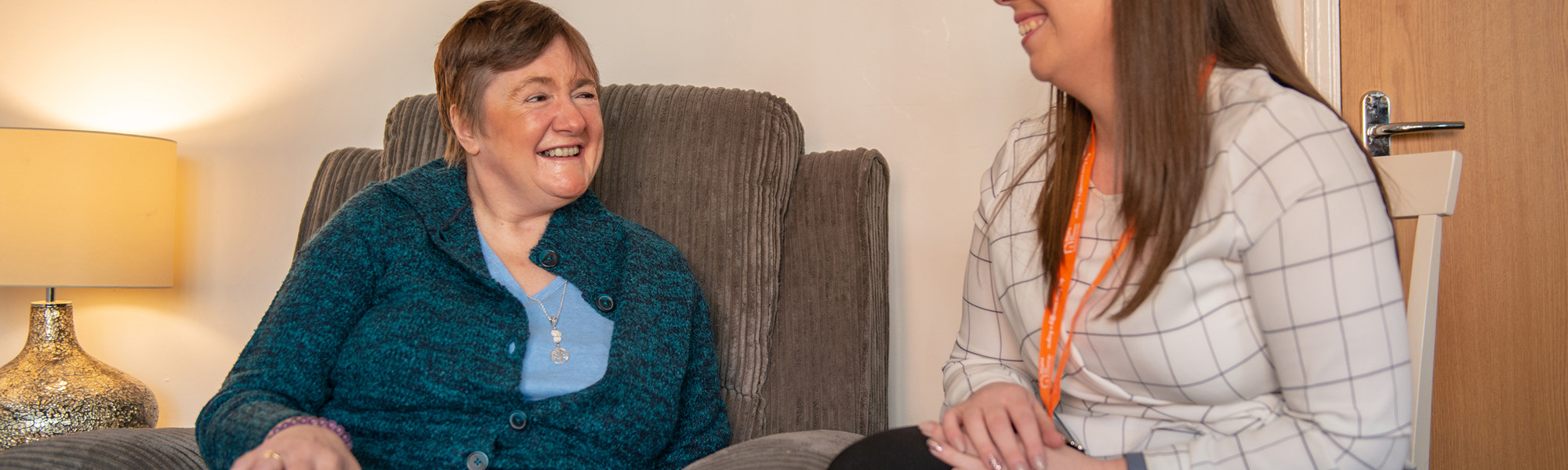 Client and CareGiver sitting down and speaking