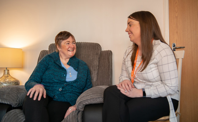 Client and CareGiver sitting down and speaking