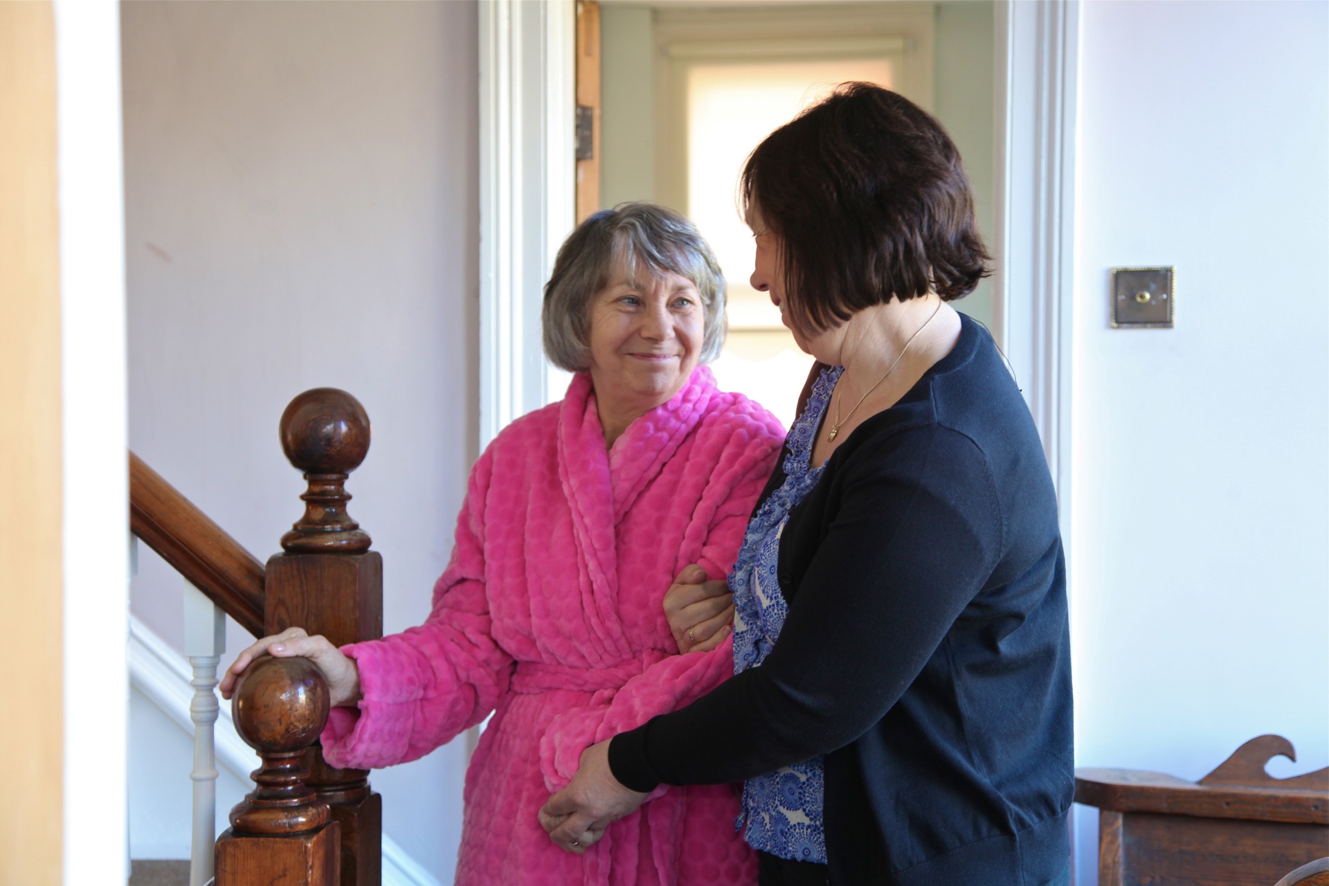 caregiver helping client in their home