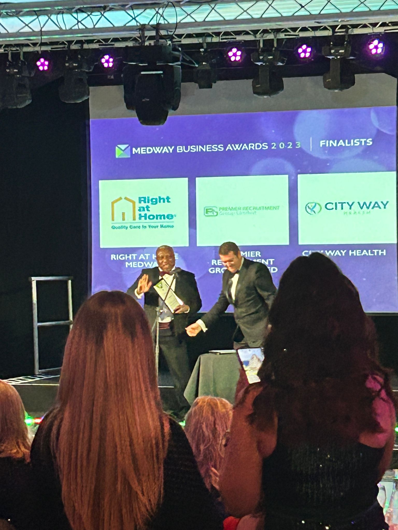 MD receiving Finalist Certificate on stage