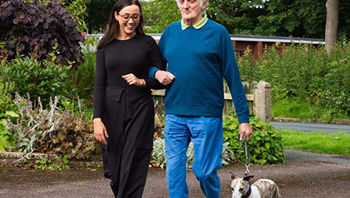 Post Stroke Client Walking With CareGiver