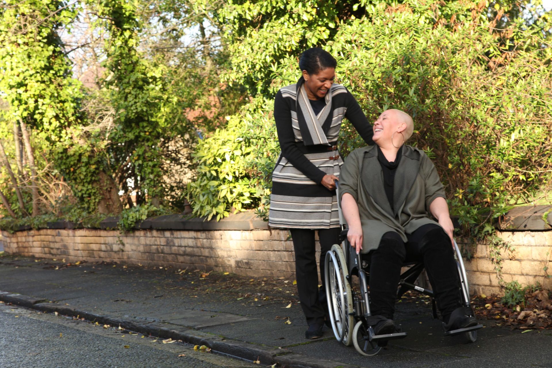 Female Wheelchair User With Caregiver