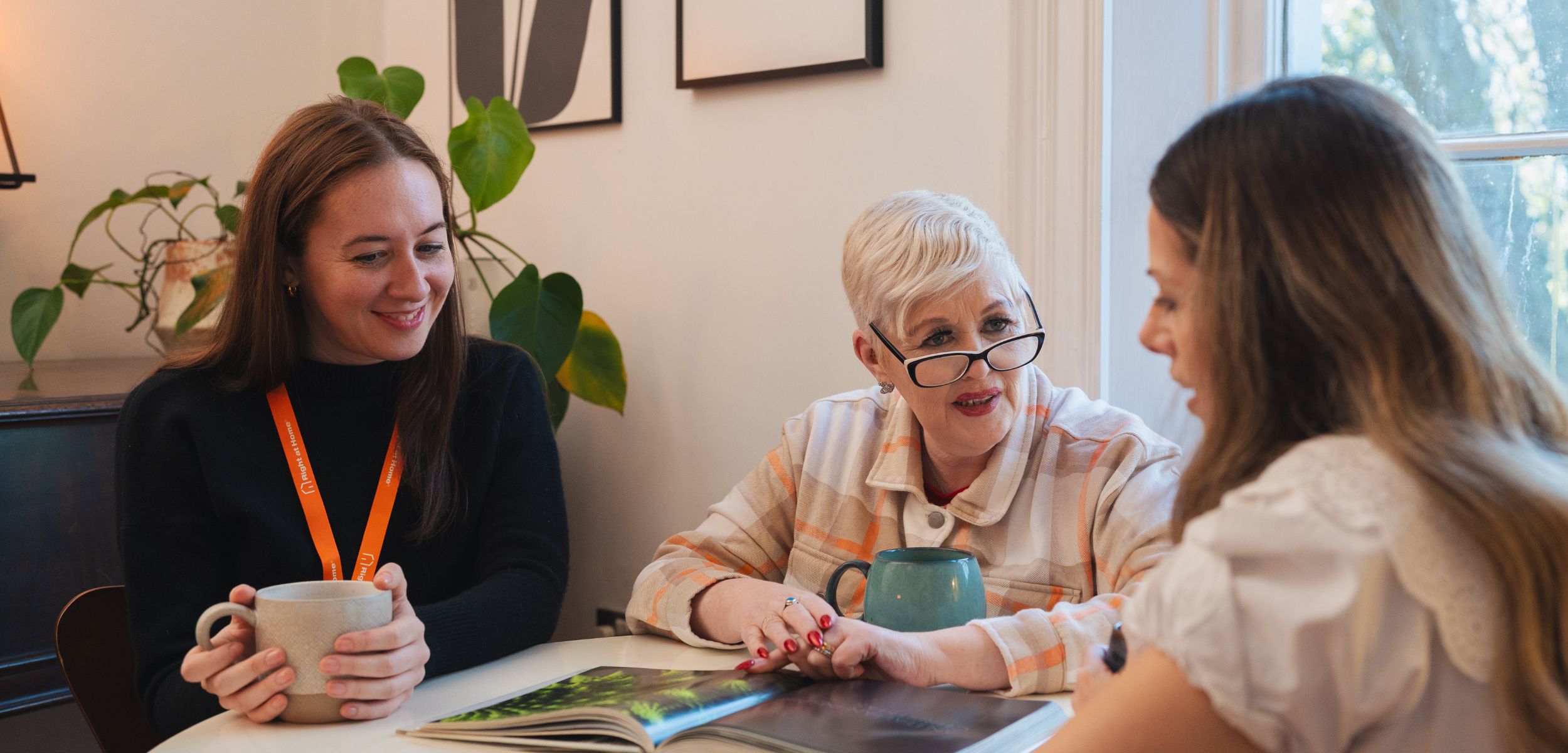young-daughter-and-carer-talking-through-the-options-available-in-their-home-in-macclesfield