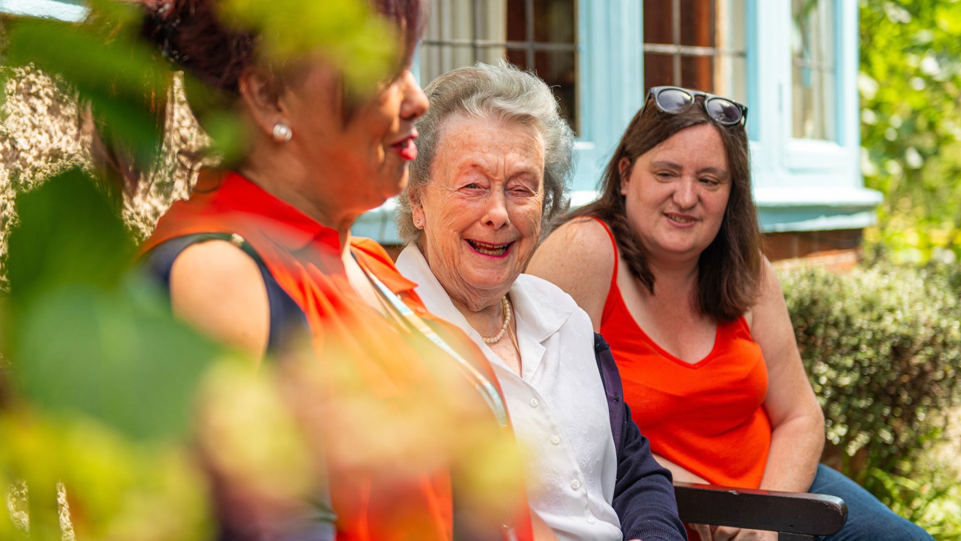 Client laughing in a garden