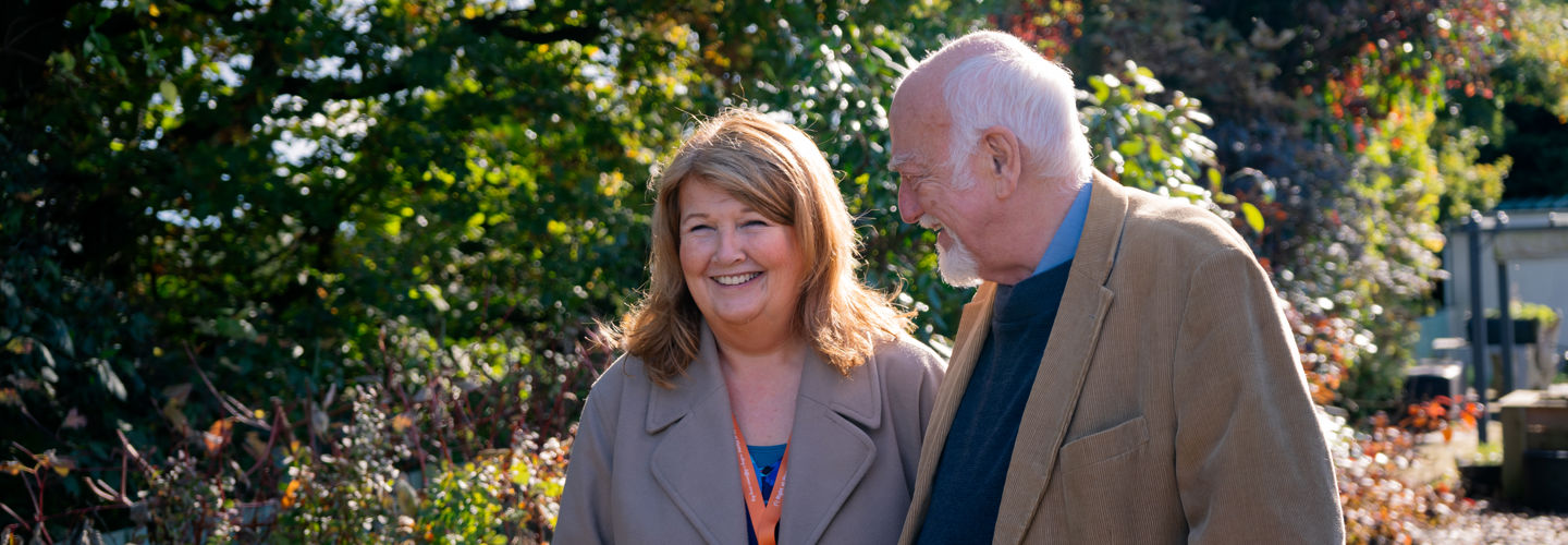 Client and CareGiver on a walk