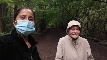 carer walking with a client