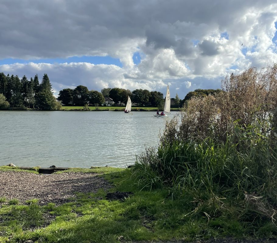 View across Yeadon Tarn with sailing boats during one of the Walk for Hearts fundraising walks.