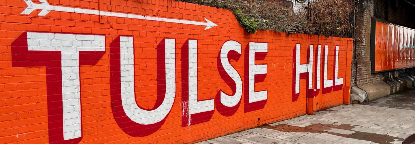 Tulse Hill station wall orange graphic