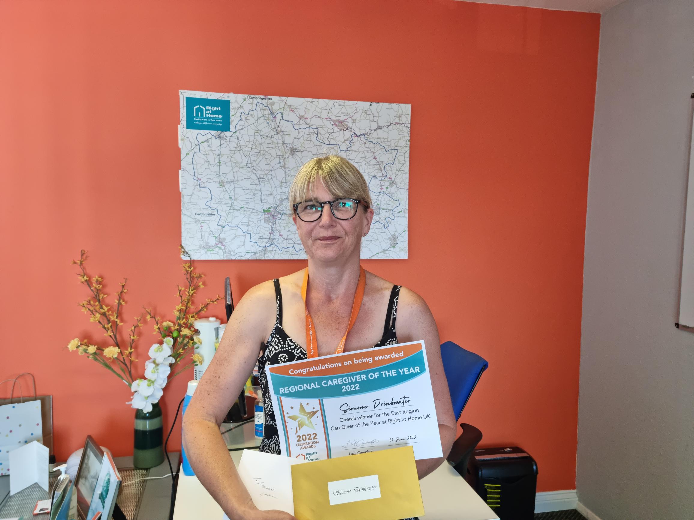 Simone Drinkwater, Regional CareGiver winner for the East Region collecting her award