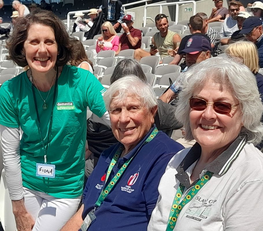 people smiling at cricket match