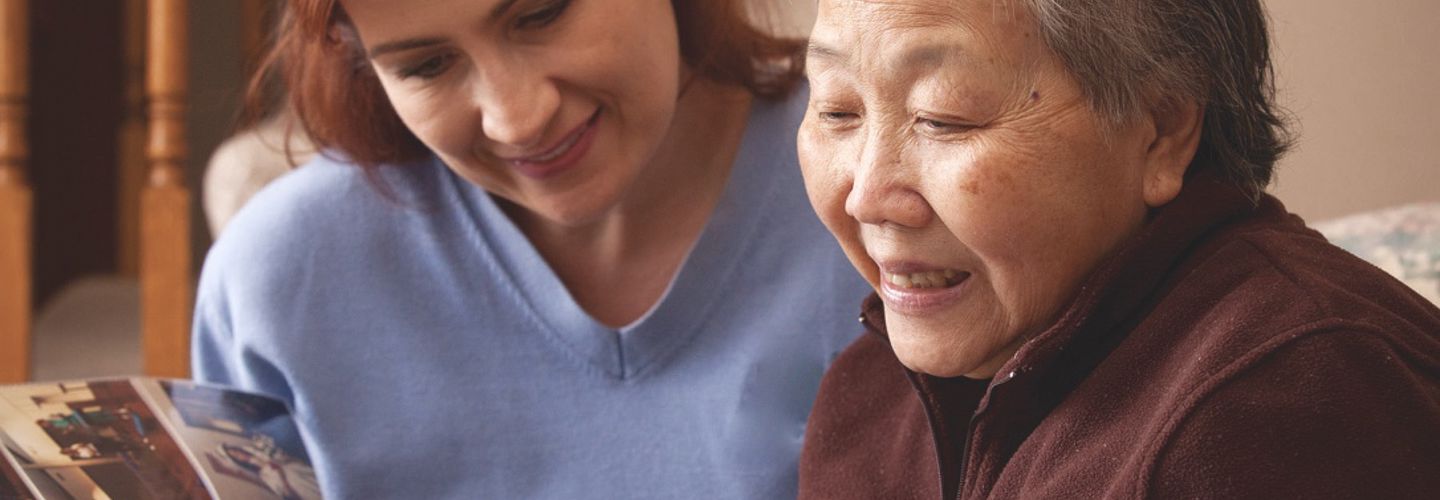 CareGiver and client looking at book