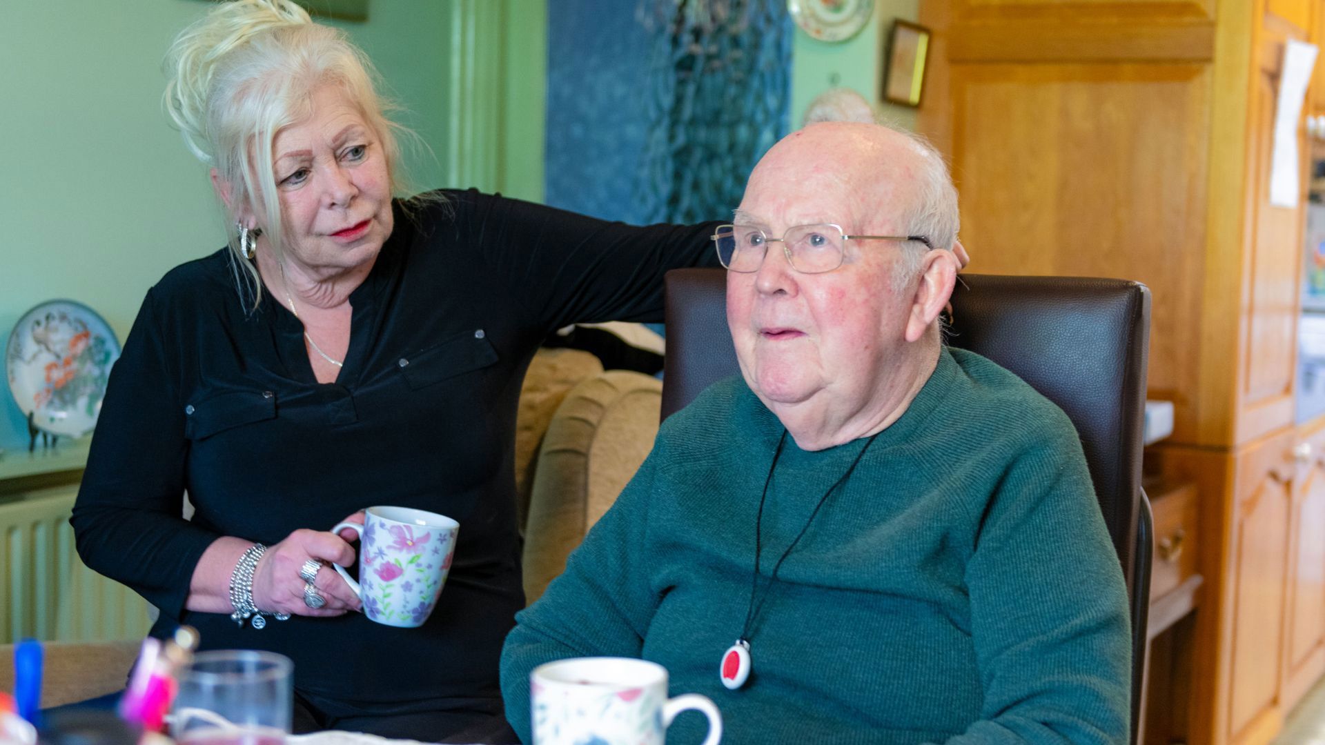 homecare client sitting with caregiver in home