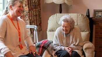 Client and Carer laughing together