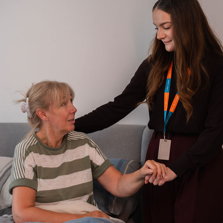 Carer supporting client inside
