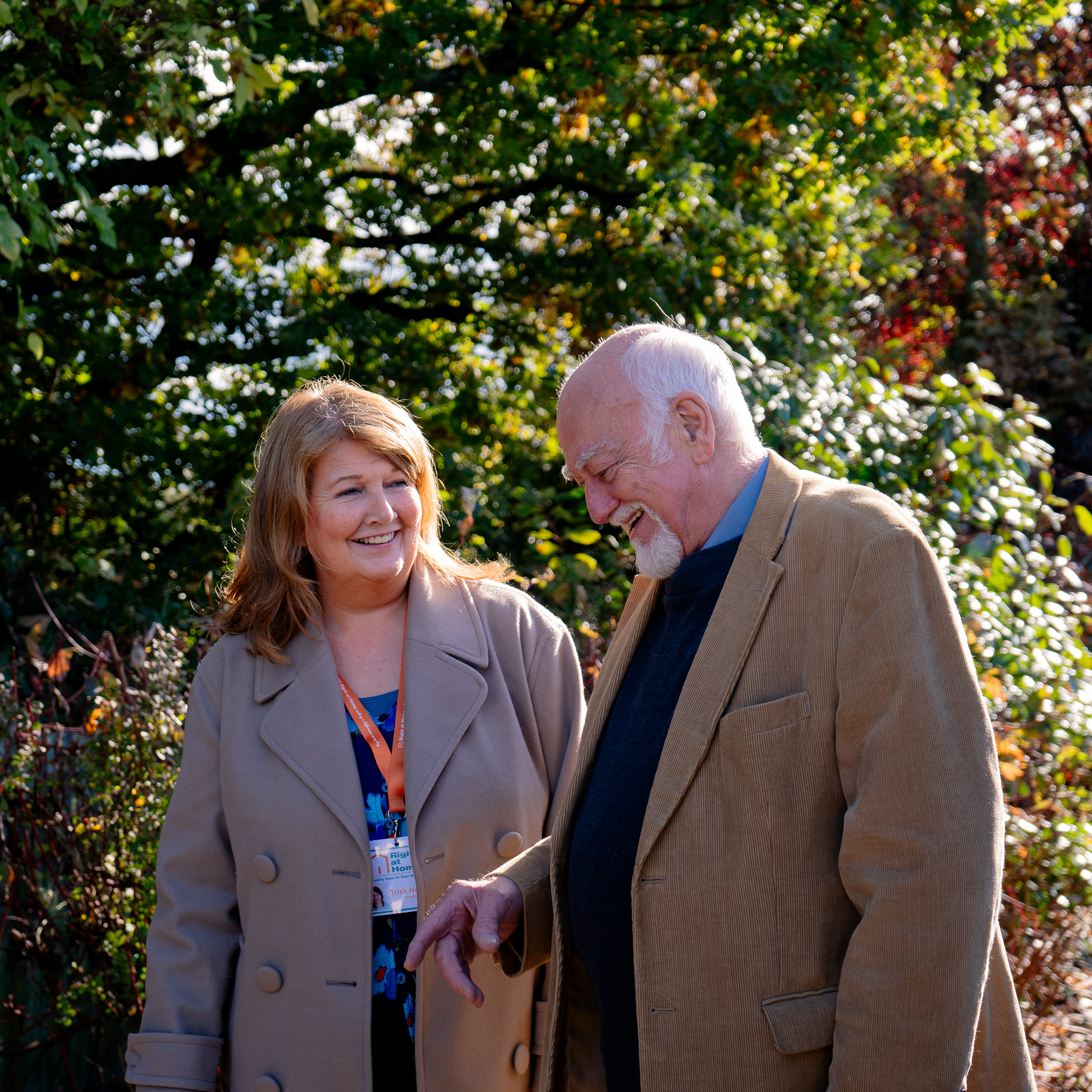 Carer and Client Strolling Through Park