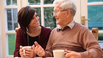 home care or nursing home caregiver with client
