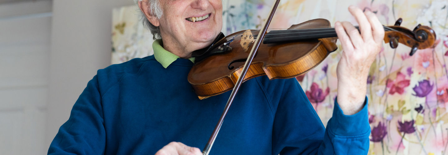 Client playing the violin