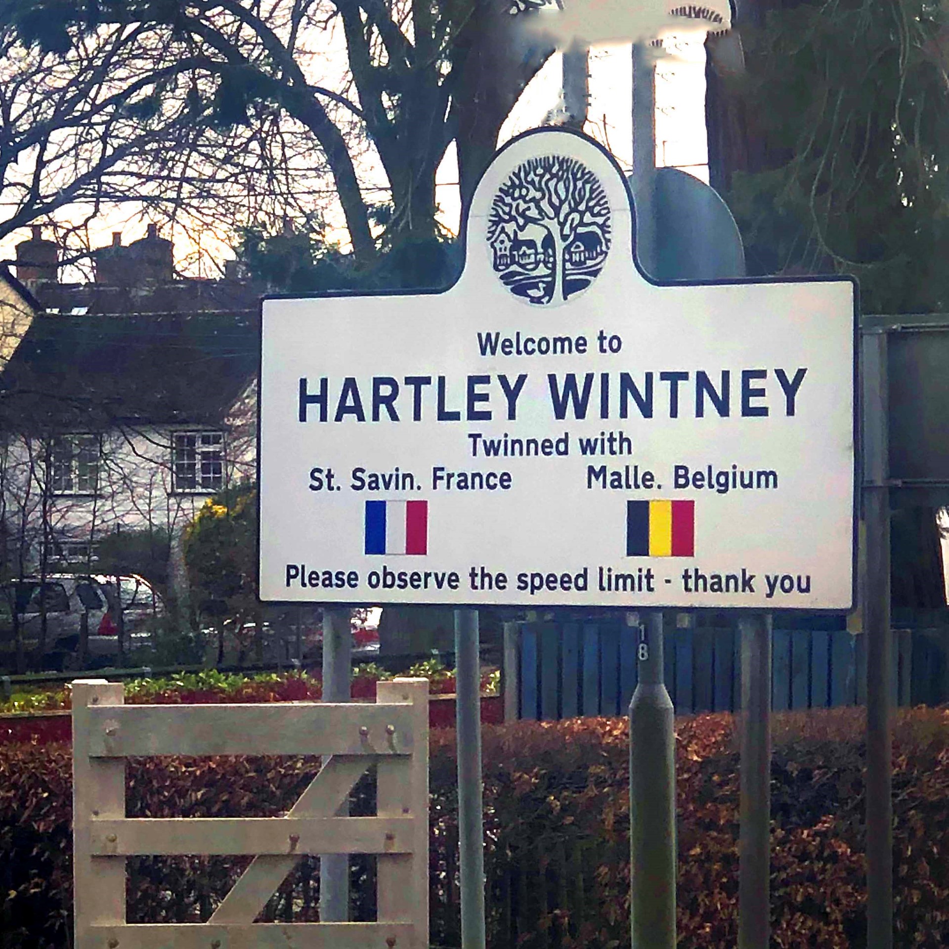 Picture of a road sign welcoming people to Hartley Wintney