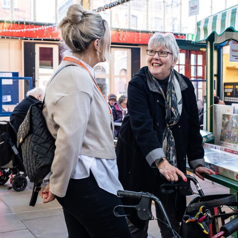 Our Client enjoying a trip to a local market with their Carer